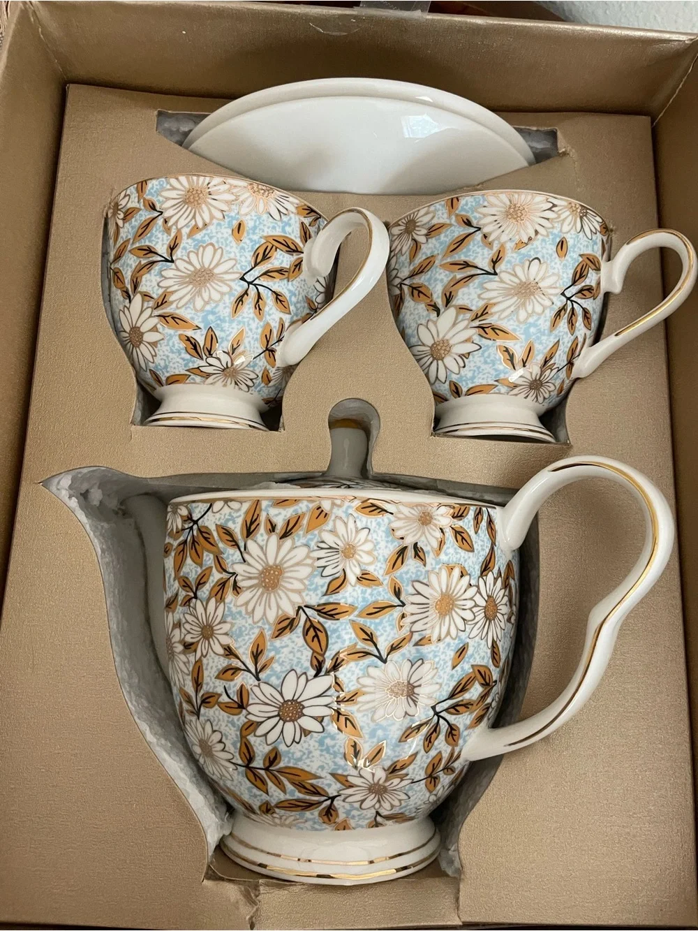Elegant Floral Porcelain Teapot and Cup Set in Blue and Gold